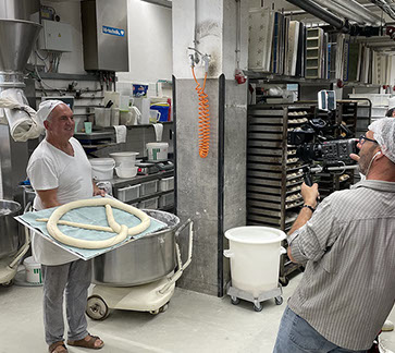 Local Producer on loacation at the remains of the Berlin Wall. When producing documentary, time is money and time is story telling time